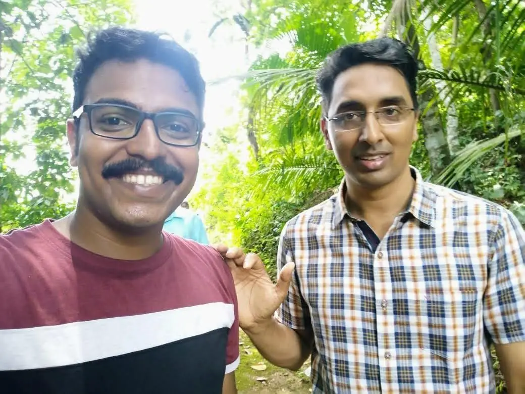 Blessan Kurien Thomas with a colleague during a field visit